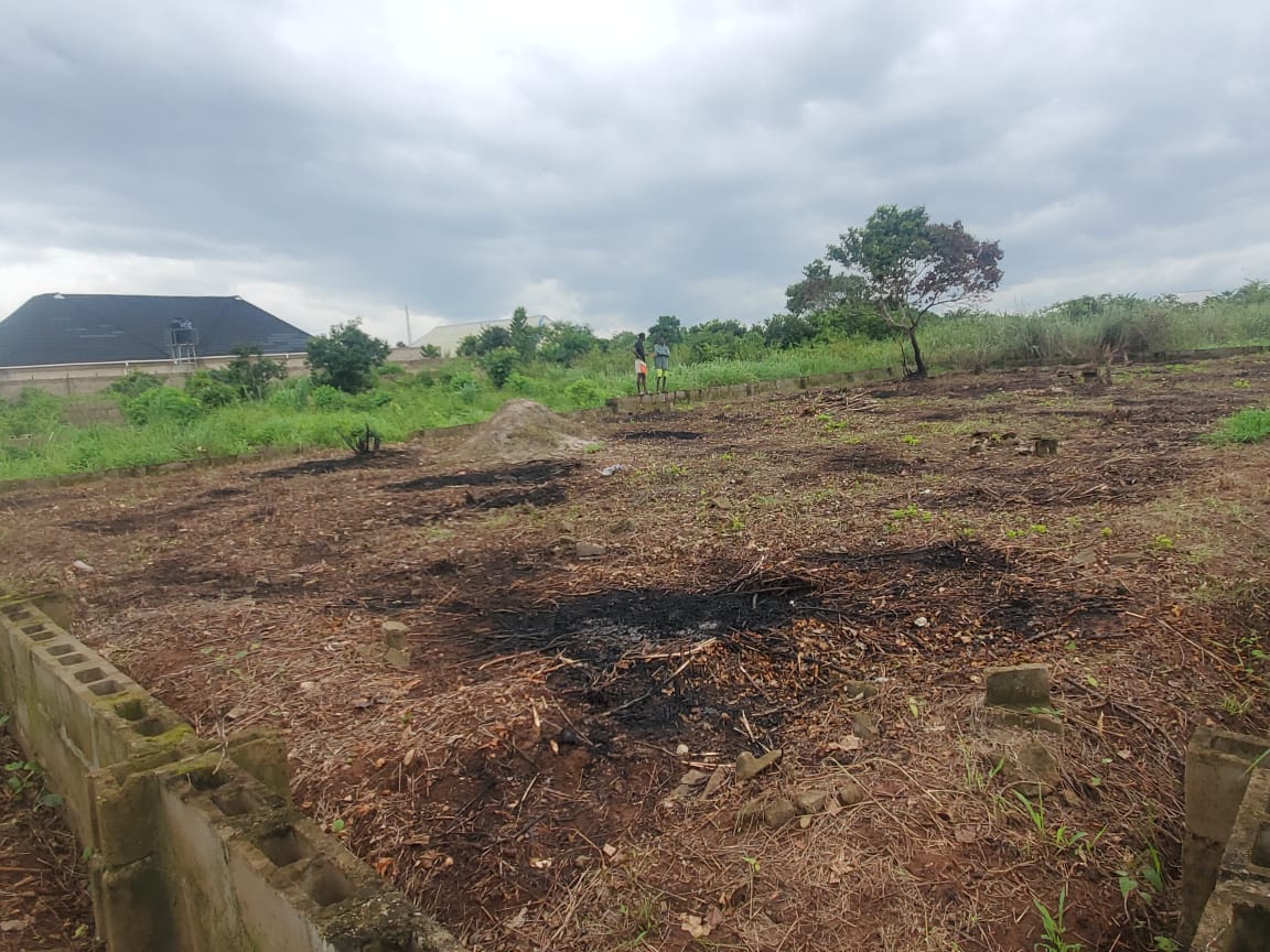 A plot of land half-fenced for sale at Sarunmi, Ilaro, Ogun State